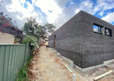 Expertly constructed curved brick wall with decorative finish