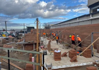 Brickwork progressing across a multi-level development site